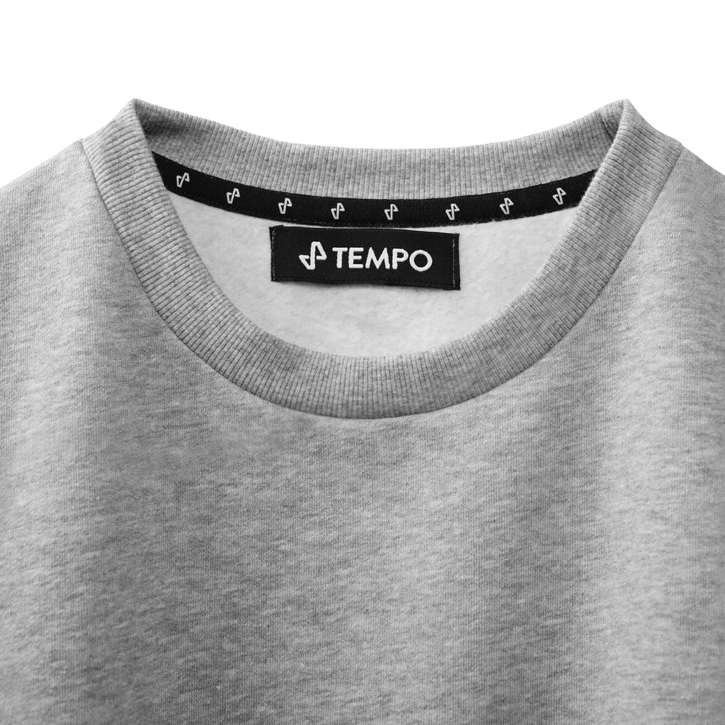 closeup of upper front of cool grey Ascend Sweatshirt showing Tempo Logo neck label