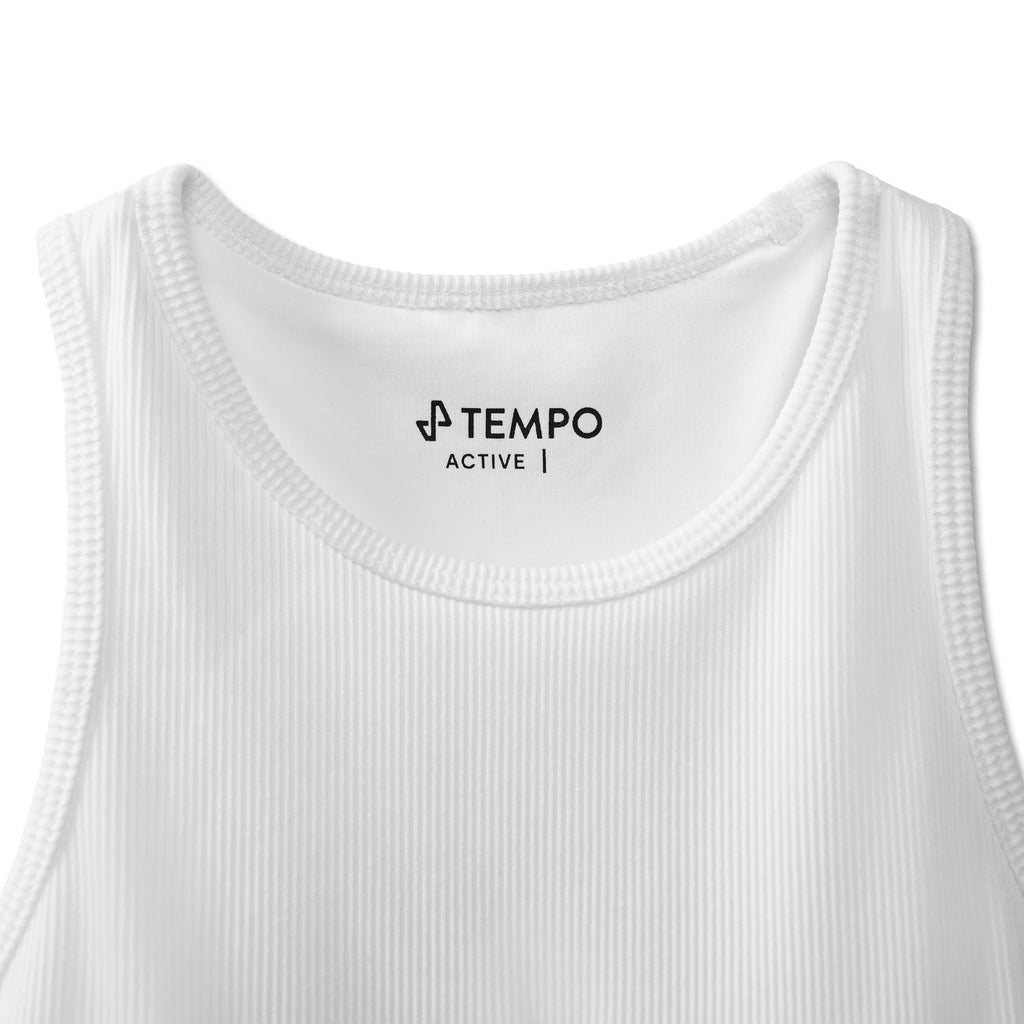 closeup of upper front of white Breakthrough Tank showing tempo neck label with active text beneath